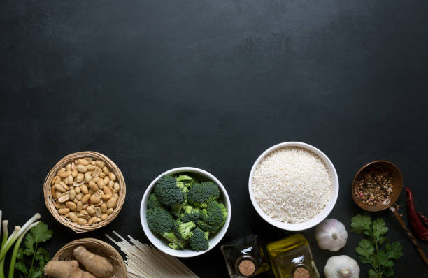 istock Chinese food raw ingredients, vegetables and nuts on the dark background 945200616