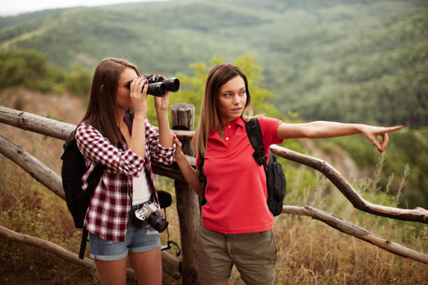 istock Two young women hiking and exploring the mountain 945203150