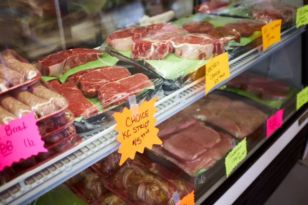 istock Assorted cuts of fresh meat displayed on trays 945210622