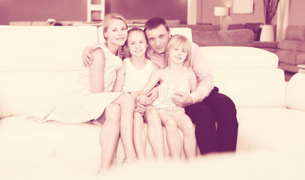 istock Family is satisfied by new bought sofa 945213292