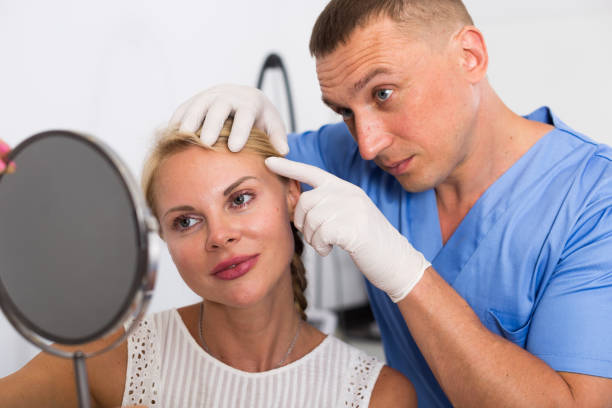 istock Doctor is examining woman patient behind mirror before the procedure 945213556