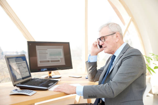 istock Senior professional man consulting with his client 945217592
