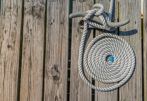 Spiral rope in a wood pier.