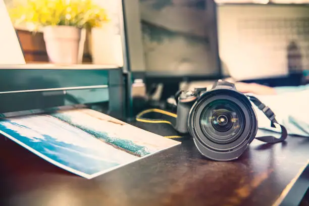 Photo of Unknown camera and photo printer on the graphic desk
