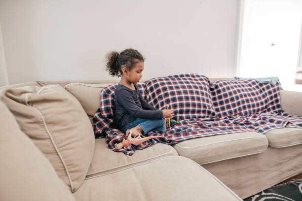 istock Child Playing Alone at the Living Room 945236228