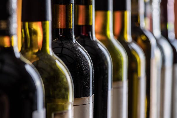 istock Line of wine bottles. 945236586