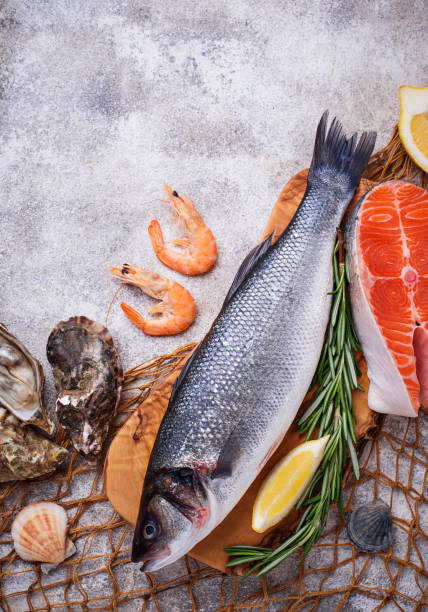 istock Seafood concept. Fish, shrimps and oysters. 945247152
