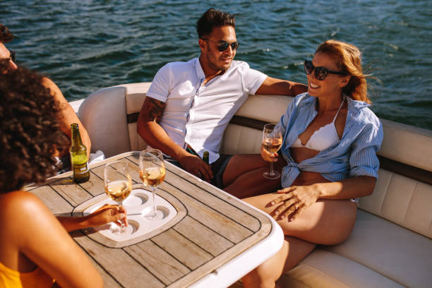 istock Young friends partying on a boat 945247340