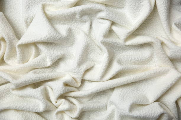 istock Cotton blanket with an interesting texture and crumpled irregularly in a rather artistic way. 945253024