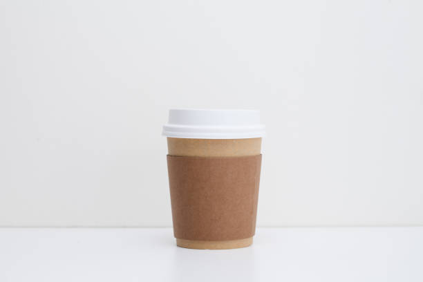 istock Take away paper cup with yellow sticker 945258580