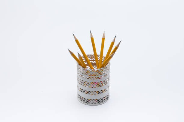 istock Yellow pencils in white metal pot on a white background 945258684