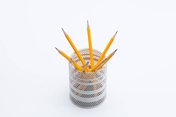 istock Yellow pencils in white metal pot on a white background 945258686