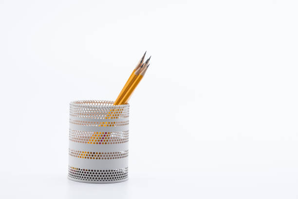 istock Yellow pencils in white metal pot on a white background 945258740