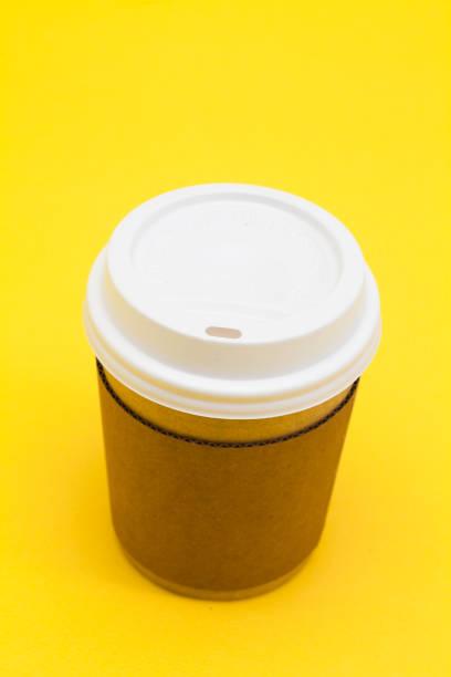 istock Take away coffee cup on the yellow background 945259370