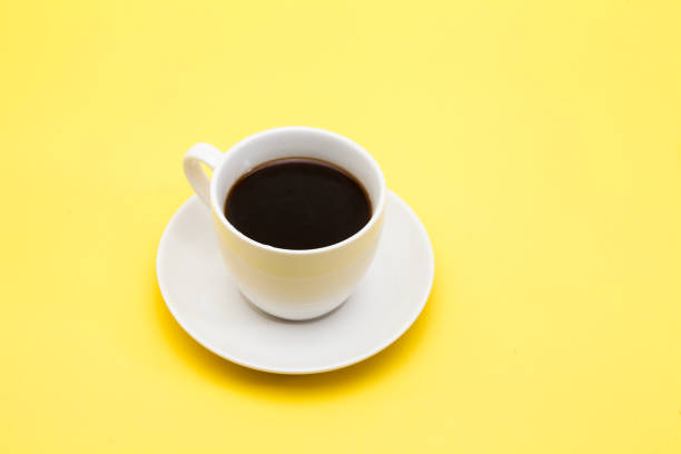 istock A cup of coffee on a yellow background 945259612