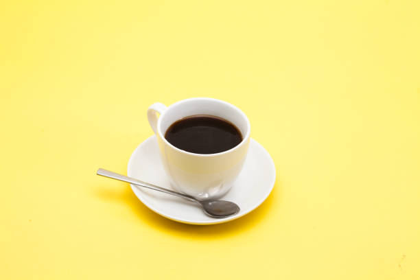 istock A cup of coffee on a yellow background 945259658