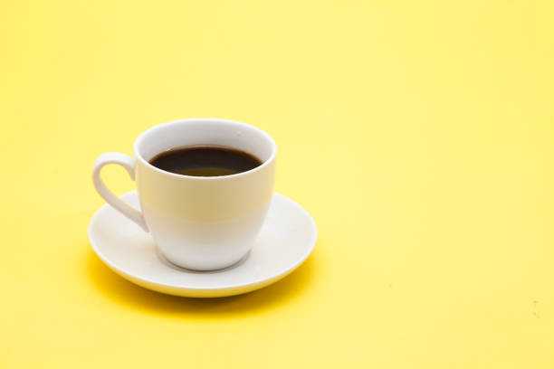 istock A cup of coffee on a yellow background 945259698