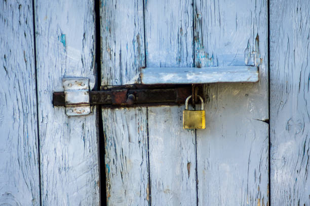 istock Old door with metal locker 945259886