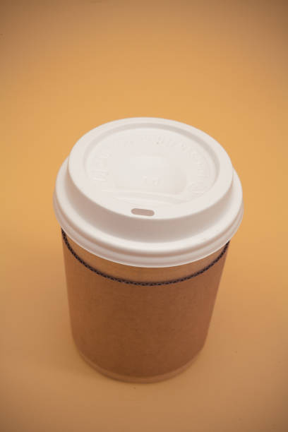 istock Take away coffee cup on the yellow background 945260446
