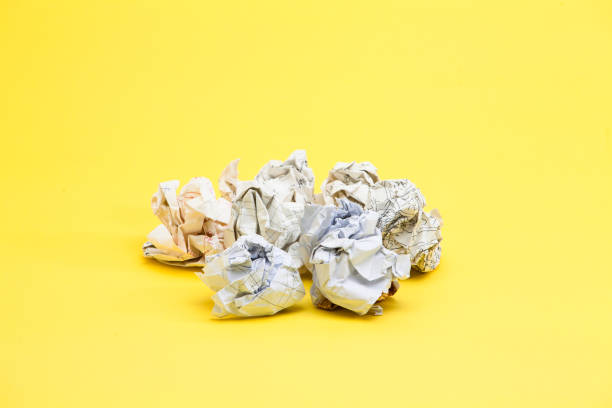 istock Crumpled papers on the yellow background 945260662
