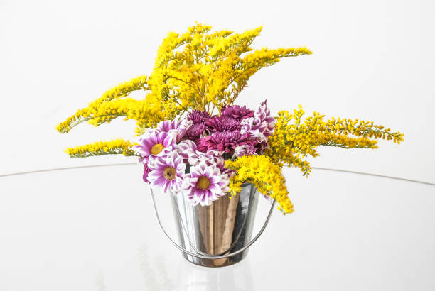 istock Small Flower Arrangement on the Glass Table. 945264268