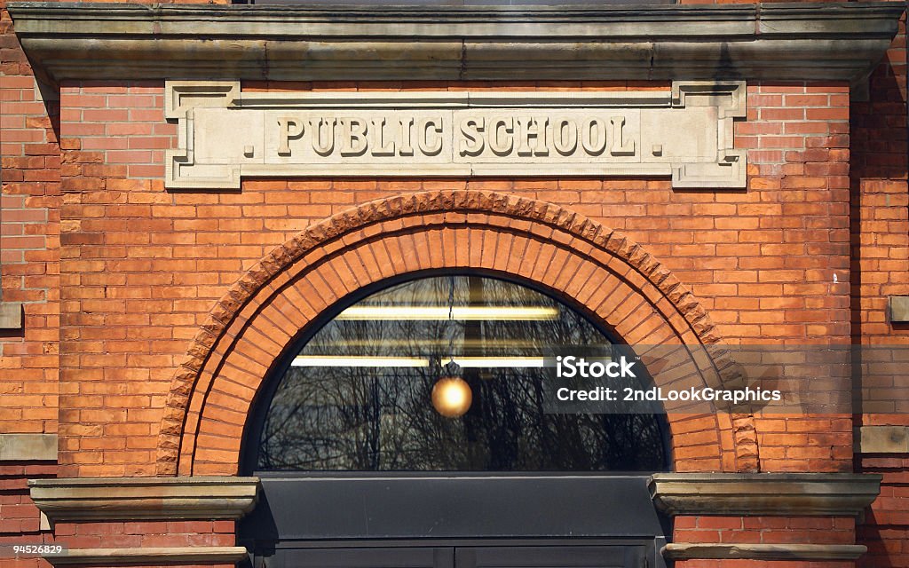 Public School Building Entrance to an Old Red Brick Public School Building High School Stock Photo