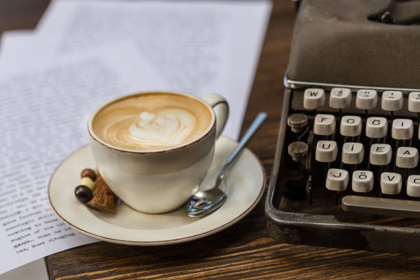 a cup of cappucino with vintage typewriter