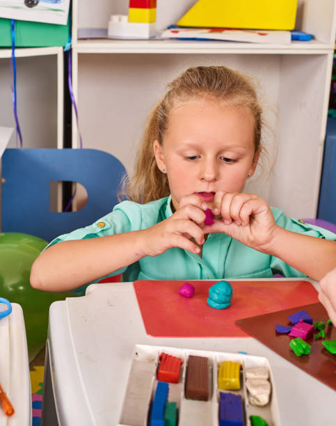 istock Plasticine modeling clay. Child dough play in school. 945285928