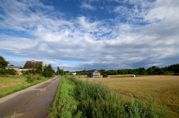 istock Country road under a cloudy sky 945286204