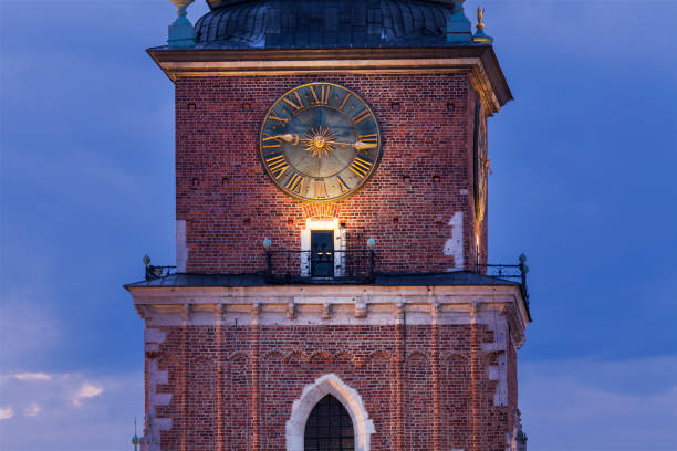 istock Clock on old rathaus tower in Krakow 945290288