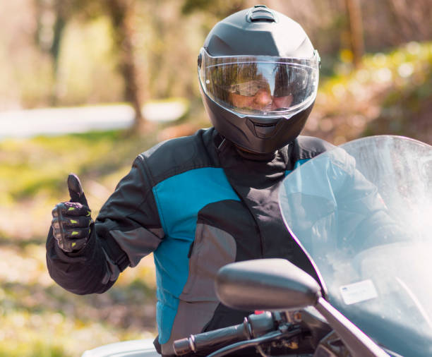 istock The man on the motorcycle shows the thumb up 945296984