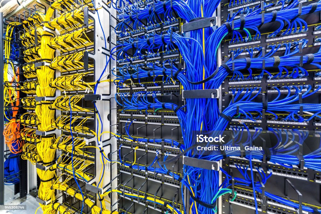 Rack with generic Ethernet cat5e cables Rack with generic Ethernet cat5e cables, part of a large company data center. Cable Stock Photo