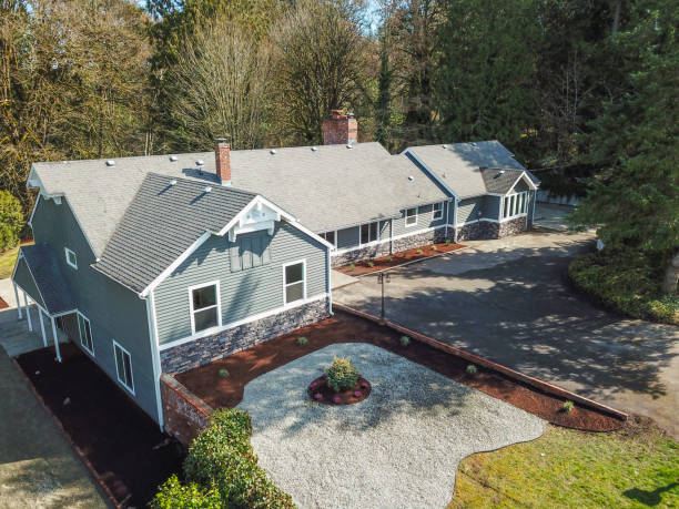 istock Aerial view of Large grey home surrounded by trees 945312454