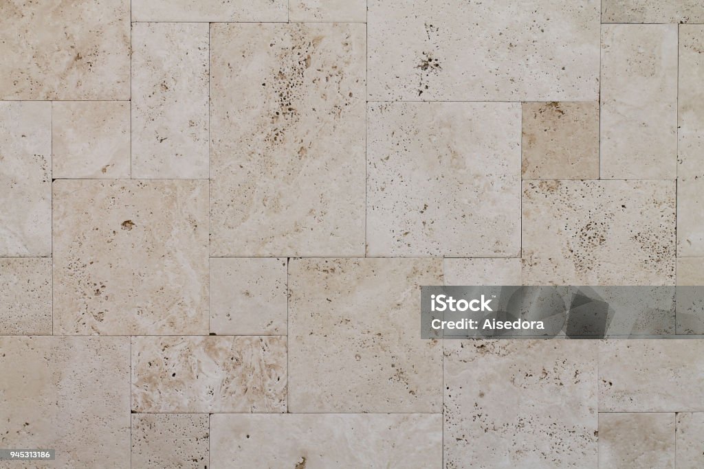 Natural Italian stone. Smooth travertine surface. Natural Italian stone. Smooth travertine surface. A sample of wall cladding with natural stone. Travertine Pool Stock Photo