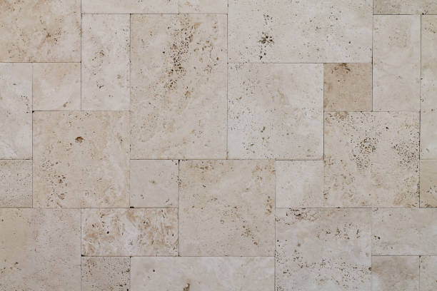 Natural Italian stone. Smooth travertine surface. Natural Italian stone. Smooth travertine surface. A sample of wall cladding with natural stone. tufa photos stock pictures, royalty-free photos & images