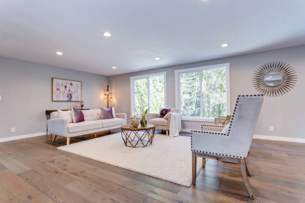 istock Spacious white living area with hardwood floor. 945313452