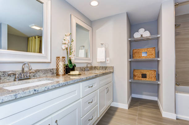 istock Elegant bathroom with long white vanity cabinet 945316762