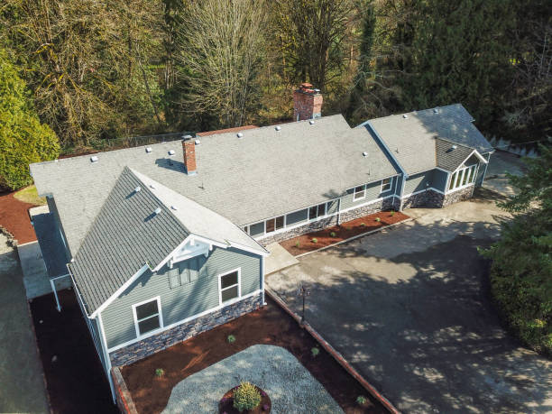 istock Aerial view of Large grey home surrounded by trees 945316812