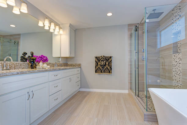 istock Light modern bathroom design with long white vanity cabinet 945317744