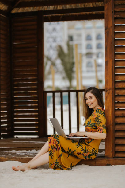 istock Young woman working on laptop 945329954