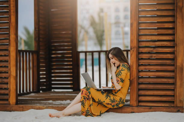 istock Young woman working on laptop 945330100