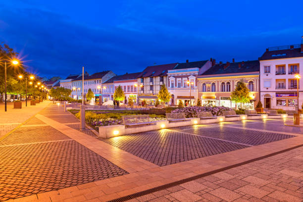 Stock photograph of the main square in in downtown Szombathely Hungary at twilight blue hour.