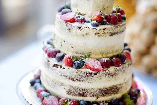 istock Delicious chocolate wedding cake decorated with fruits and berries 945343836