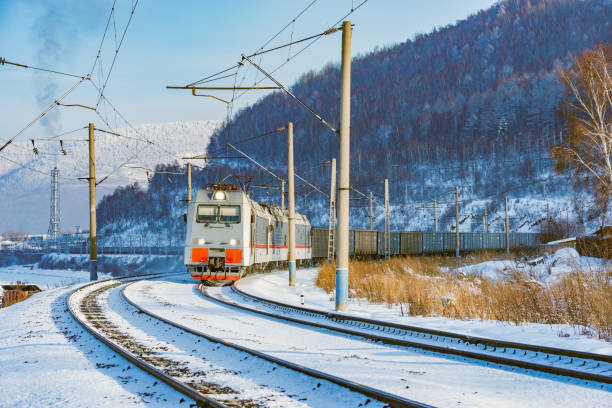 Freight train moves along Baikal lake. Trans Siberian railway. Russia.