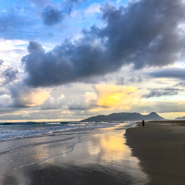 istock Dramatic sunset sky at Campeche beach in Florianopolis 945350414