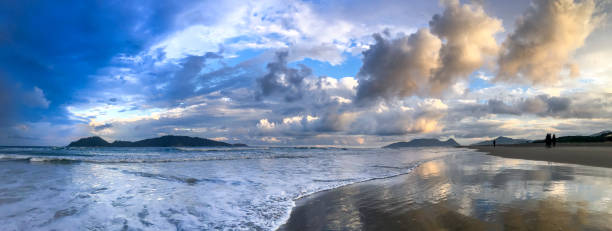 istock Dramatic sunset sky at Campeche beach in Florianopolis 945350478