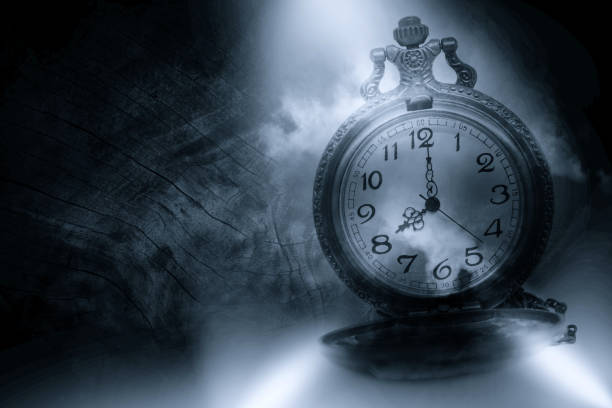 istock Vintage clock on old black wood floor. 945350586