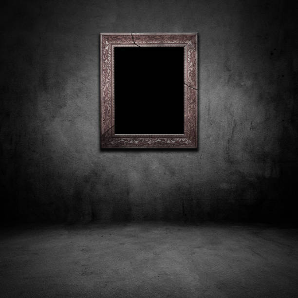 istock Old photo frame on grunge dark room 945351080