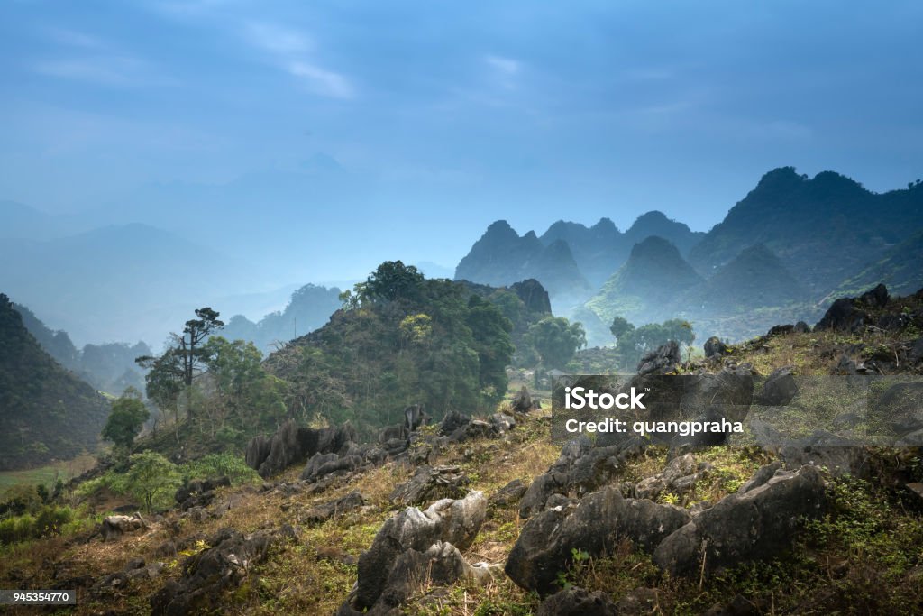 Beautiful view of a small village of ethnic minority people in the Ha Giang rocky plateau, Vietnam Agricultural Field Stock Photo