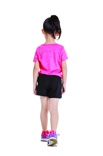 Back view. Full body of adorable asian child in sportswear back walking at studio. Isolated on white background.